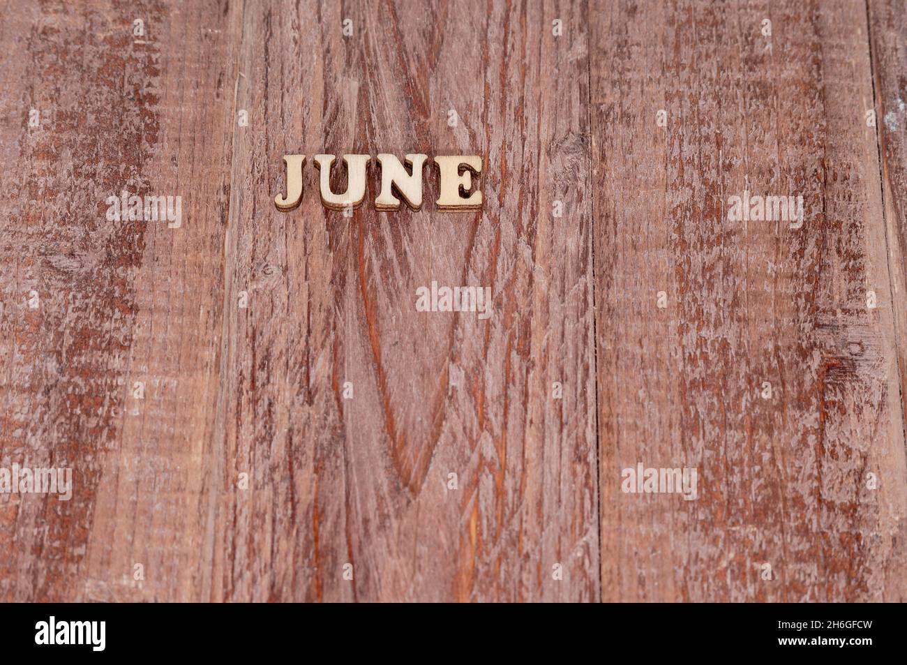 June month. Template for a calendar. The name of the months on a wooden ...