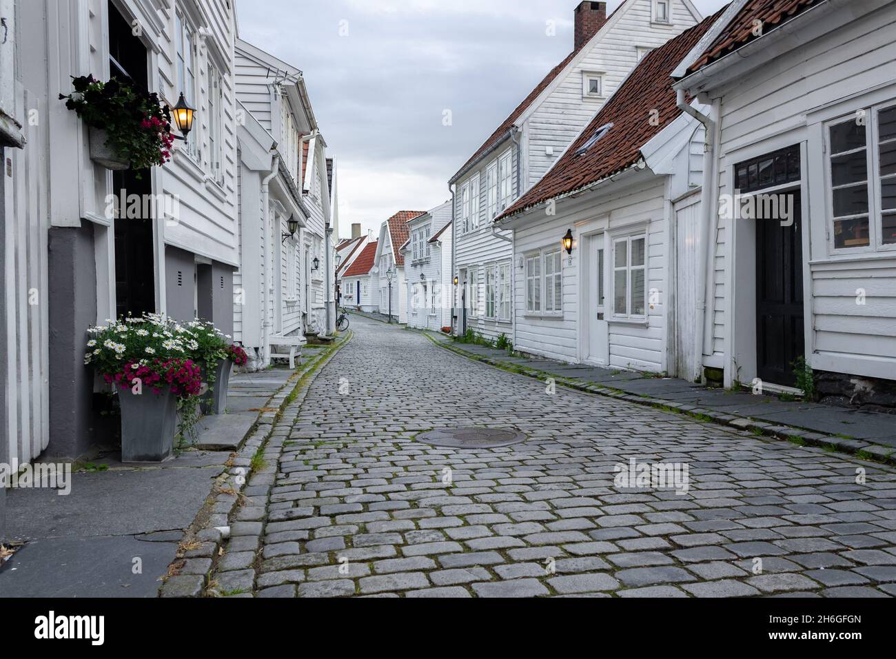 Stavanger, Norway: Ovre Strandgate, Old Town (Gamle); cobbled streets and restored wooden buildings. Stock Photo