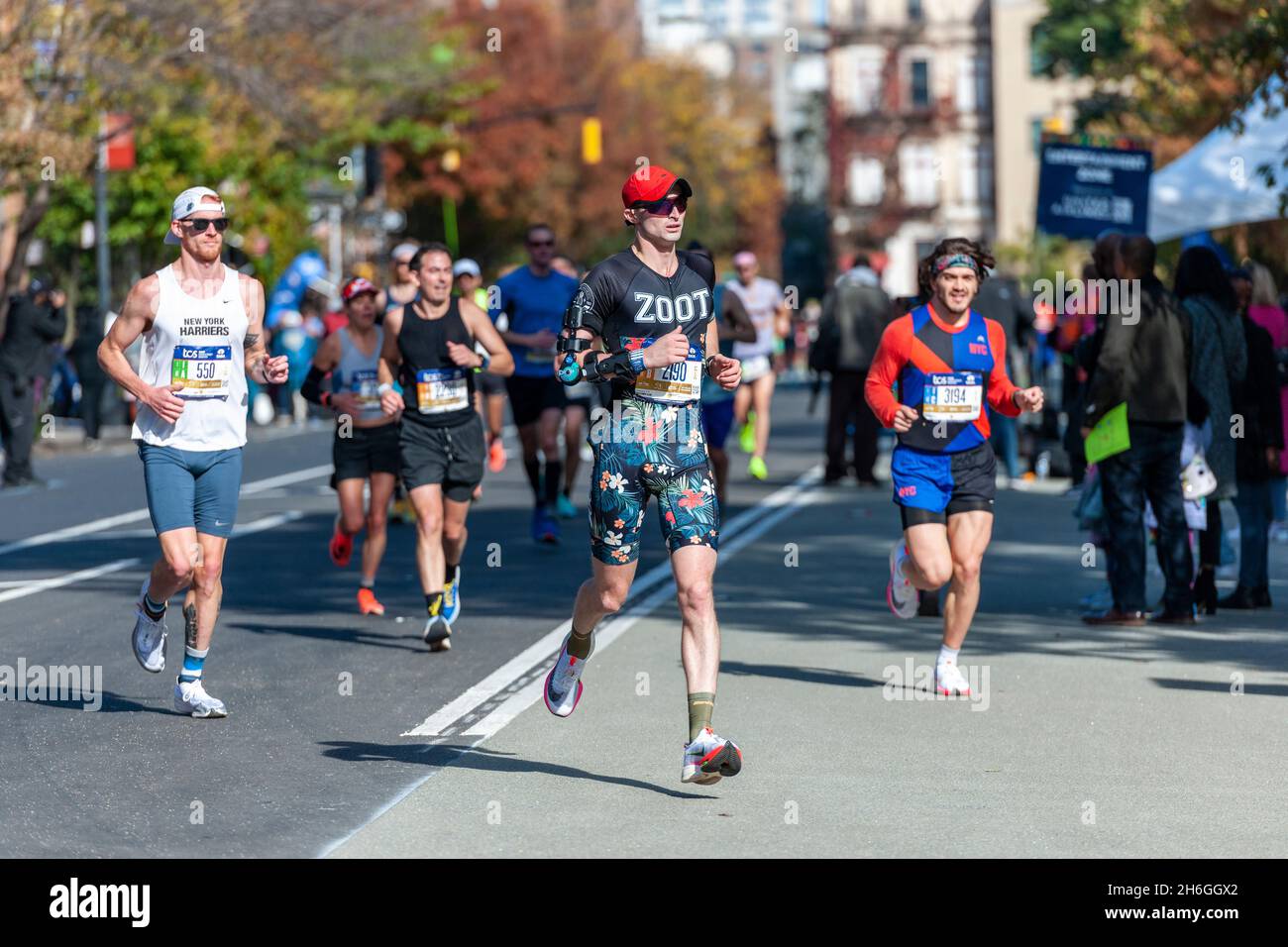 Runners pass through Harlem in New York near the 22 mile mark near Mount Morris Park on Sunday, November 7, 2019 in the 50th running of the TCS New York City Marathon. About 30,000 runners. down from the usual 50,000, participated in the race which was cancelled last year due to the pandemic.  (© Richard B. Levine) Stock Photo