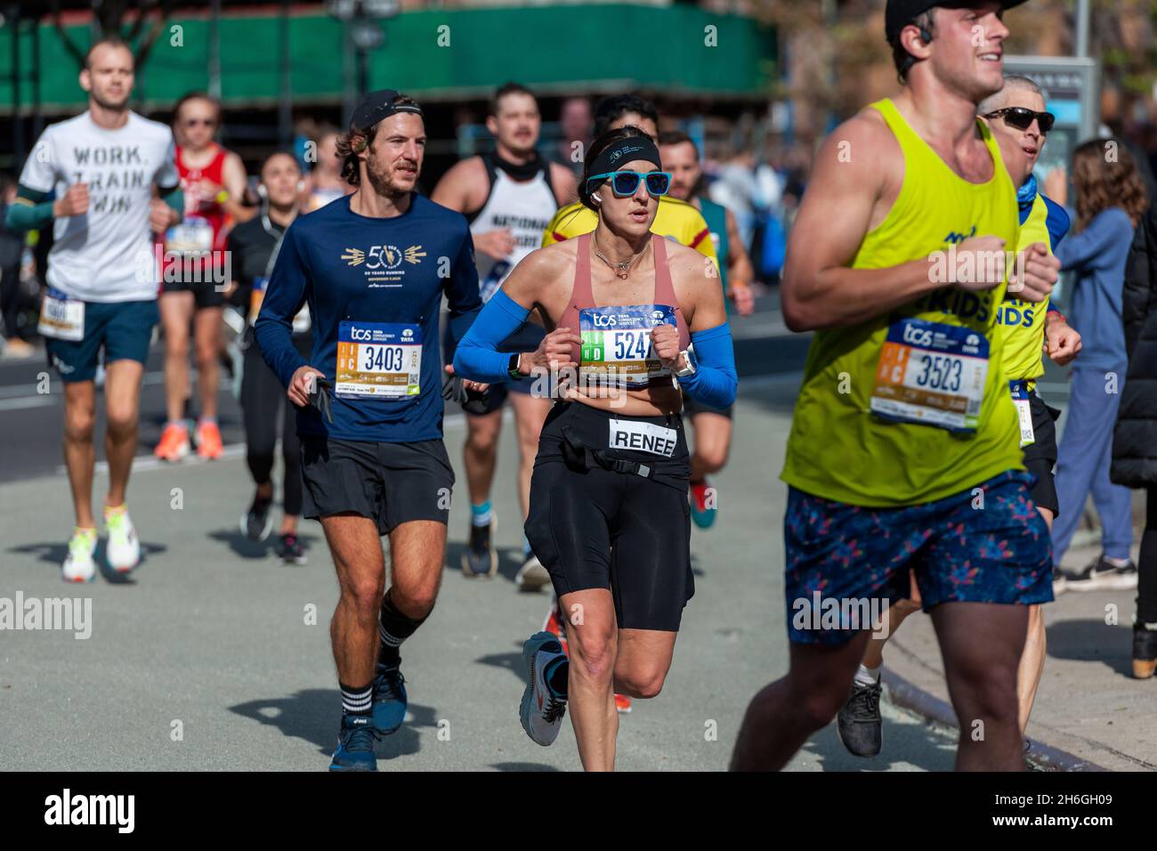 Runners pass through Harlem in New York near the 22 mile mark near Mount Morris Park on Sunday, November 7, 2019 in the 50th running of the TCS New York City Marathon. About 30,000 runners. down from the usual 50,000, participated in the race which was cancelled last year due to the pandemic.  (© Richard B. Levine) Stock Photo