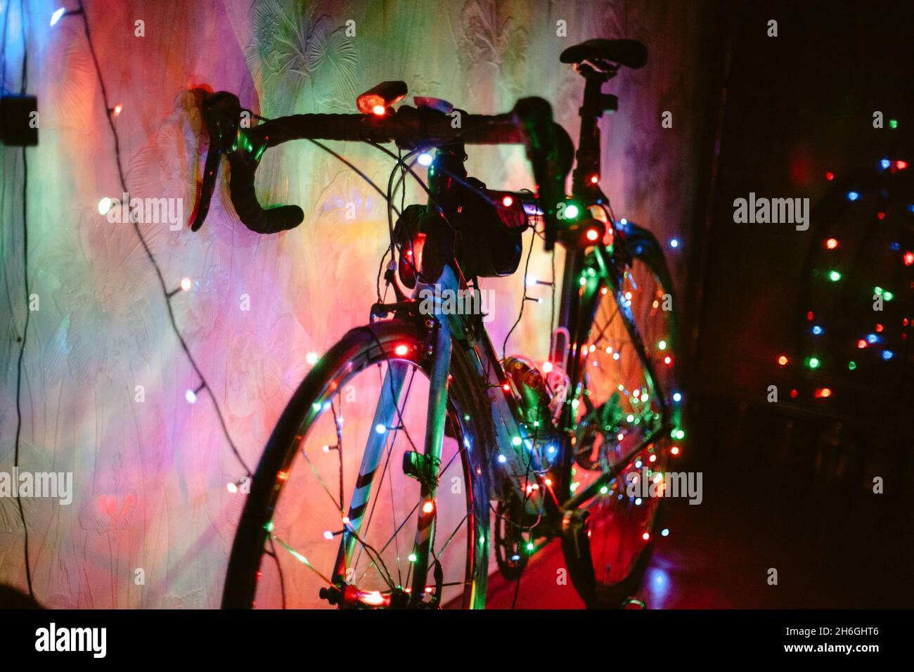 Bicycle decorated with Christmas lights Stock Photo Alamy