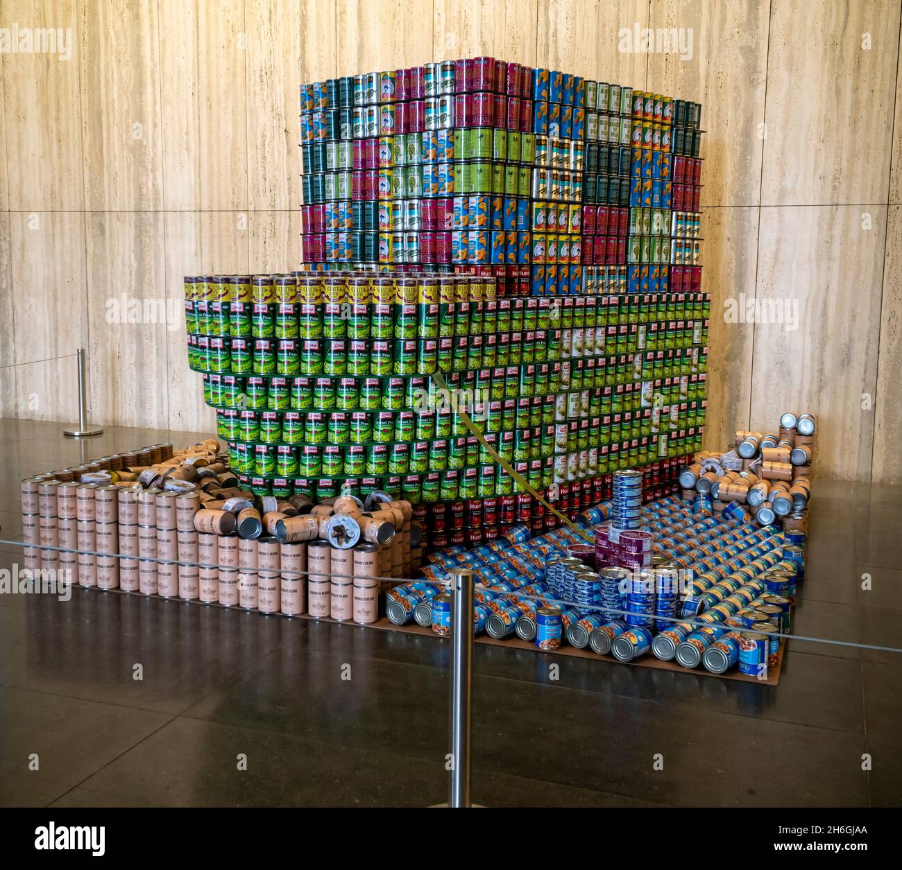 Visitors view CAN-tainers Stuck in the Suez CAN-al by AKF Group at the annual Canstruction Design Competition in New York, seen on Sunday, November 7, 2021, on display in Brookfield Place in New York. Architecture and design firm participate to design and build giant structures made from cans of food.  The cans are donated to City Harvest at the close of the exhibit. Over 100,000 cans of food are collected and will be used to feed the needy at soup kitchens and food pantries. (© Richard B. Levine) Stock Photo