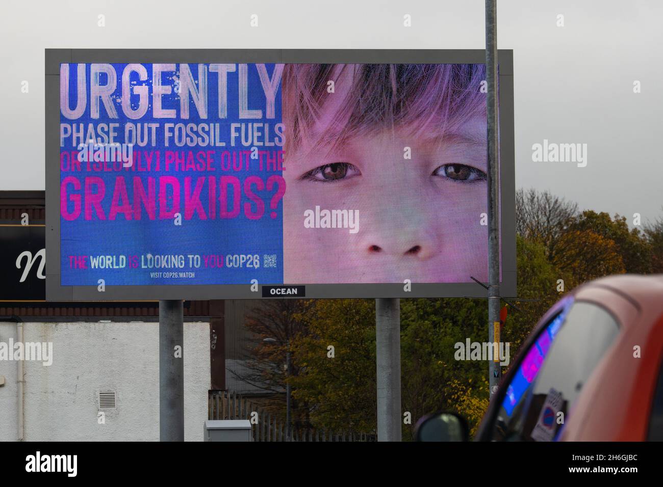 COP26 urgently phase out fossil fuels or slowly phase out the grandkids - The World is Looking to You COP26 electronic billboard, Glasgow, Scotland UK Stock Photo