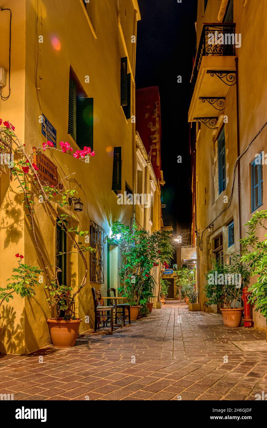 an illuminated street at night in the old town of Chania, Crete, Greece, October 13, 2021 Stock Photo