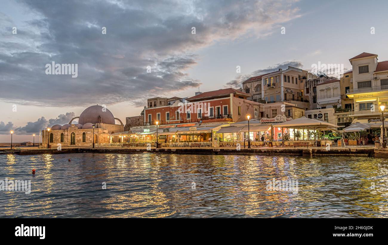 the old venetian harbour in Chania at the first morning light with reflections in the sea, Crete, Greece, October 13, 2021 Stock Photo