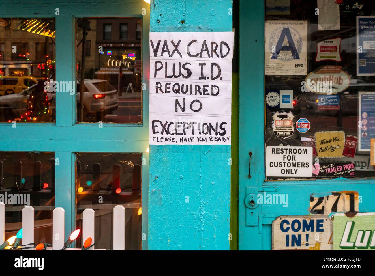 A sign outside of a restaurant in Chelsea in New York on Thursday, November 11, 2021 informs diners that proof of vaccination and identification is required for entry. (© Richard B. Levine) Stock Photo