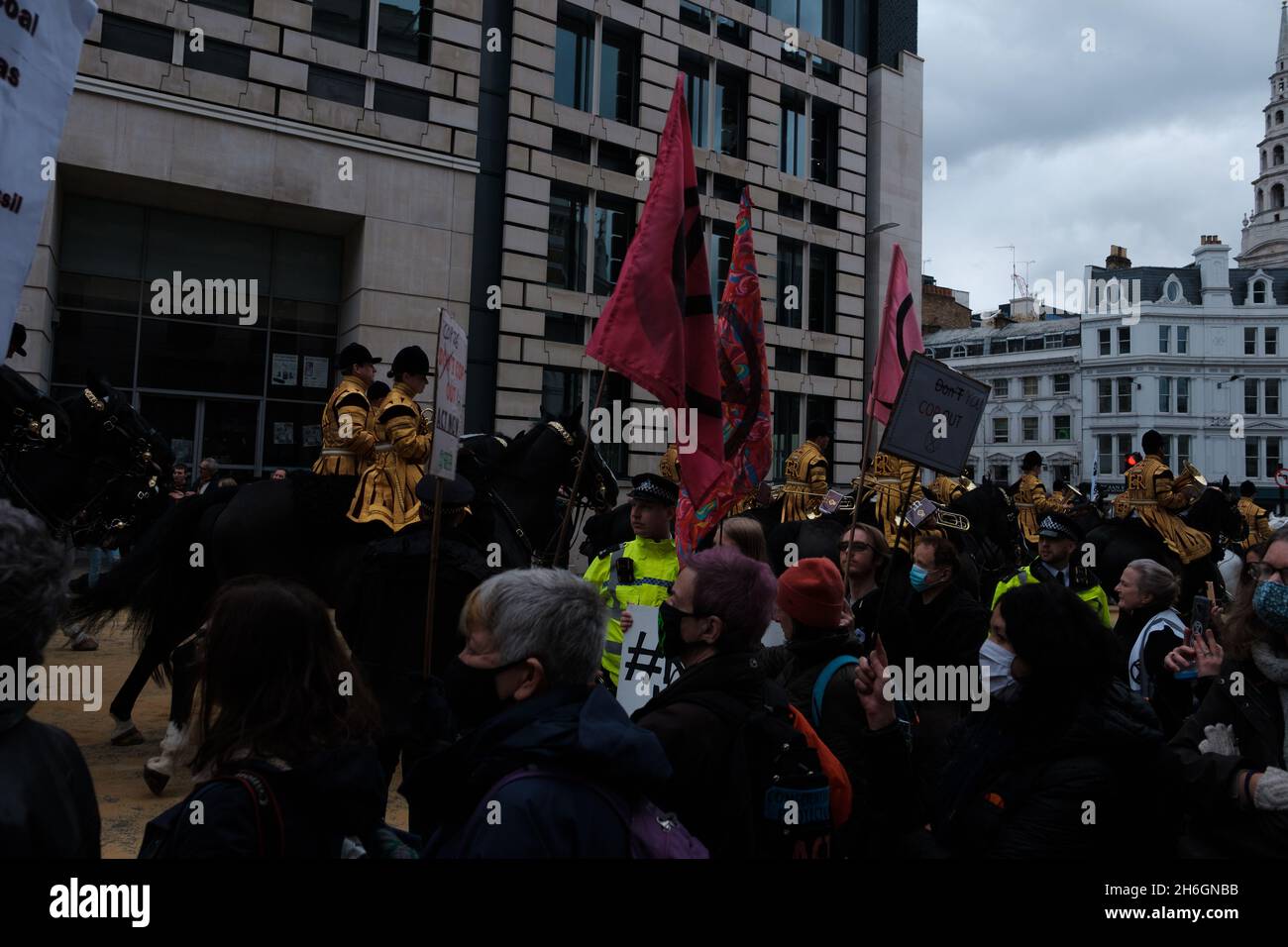 Just as COP26 ends a majority of XR and Insulate Britain return back to London to disrupt the Lord Mayor Show with their own little parade into the di Stock Photo