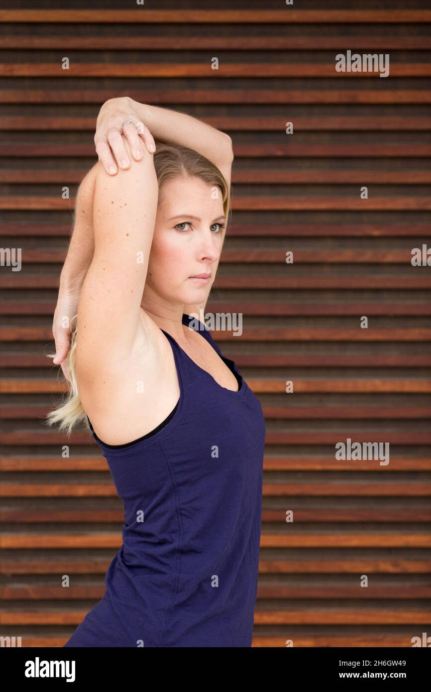 Blonde woman stretching hi-res stock photography and images - Alamy