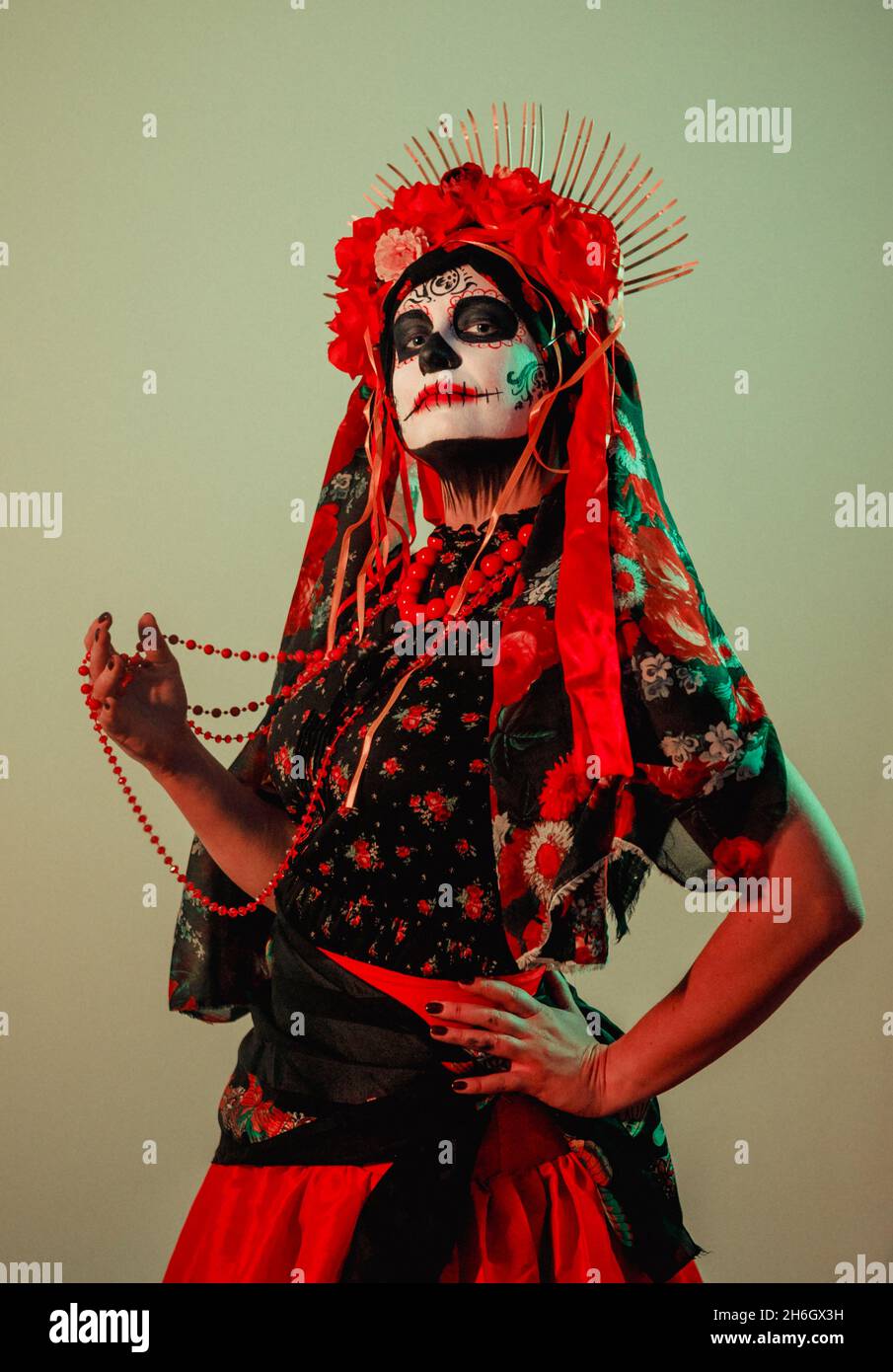 Young woman in calavera style with Mexican skull make-up on her face Stock  Photo - Alamy