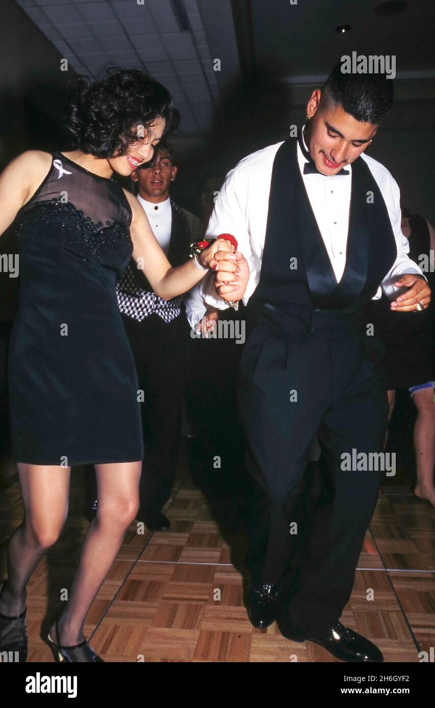 Austin Texas USA, circa 1996:Teen couple enjoys modern version of a high school tradition of prom. ©Bob Daemmrich Stock Photo
