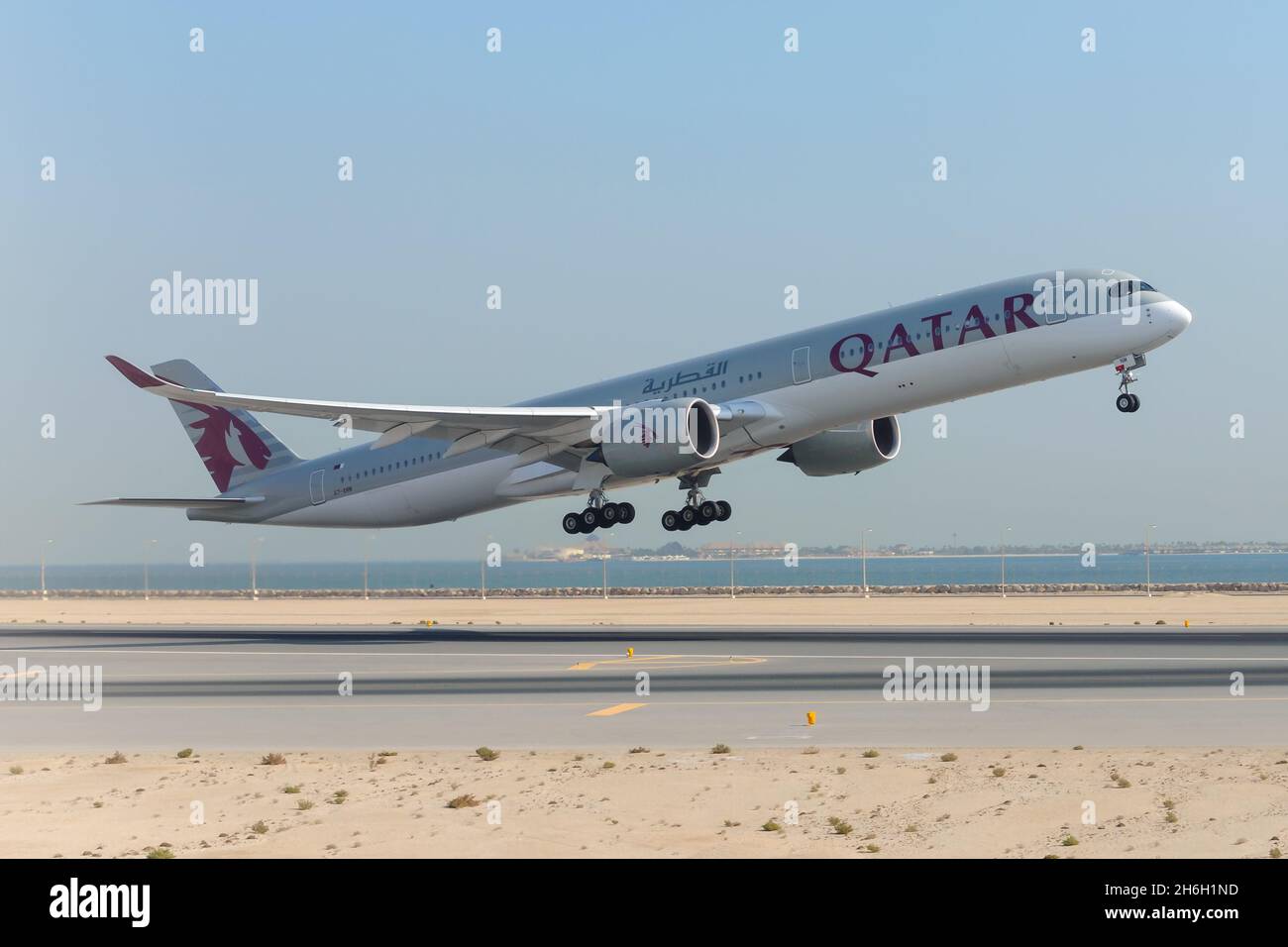 Qatar Airways Airbus A350 aircraft taking off from Doha Hamad International Airport in Qatar, the hub of Qatar Airways. Airplane departure. Stock Photo