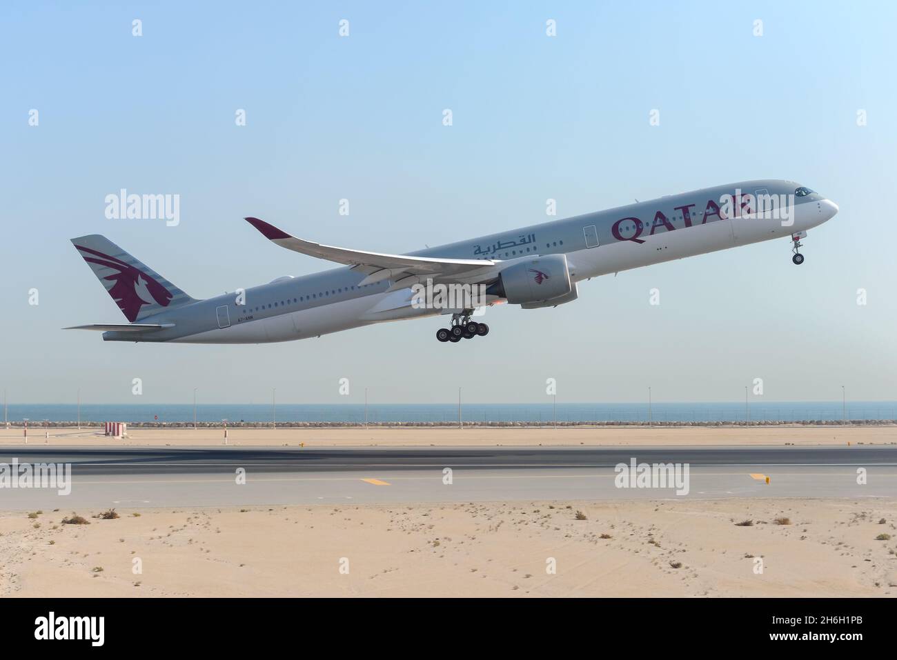 Qatar Airways Airbus A350 airplane taking off from Doha Hamad International Airport in Qatar, the hub of Qatar Airways. Aircraft take off. Stock Photo