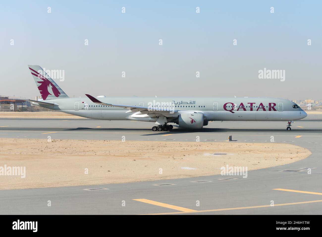 Qatar Airways Airbus A350-1000 plane at Doha Airport in Qatar. Modern A350 aircraft taxiing. Stock Photo