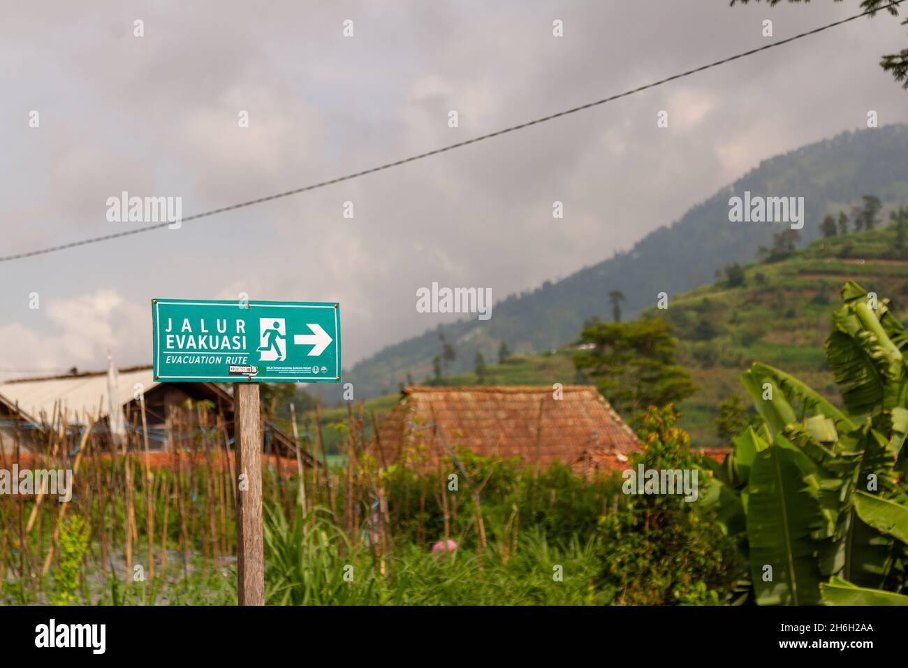 Signboard for disaster evacuation routes in the Gunung Merapi National Park area, Selo Boyolali Stock Photo