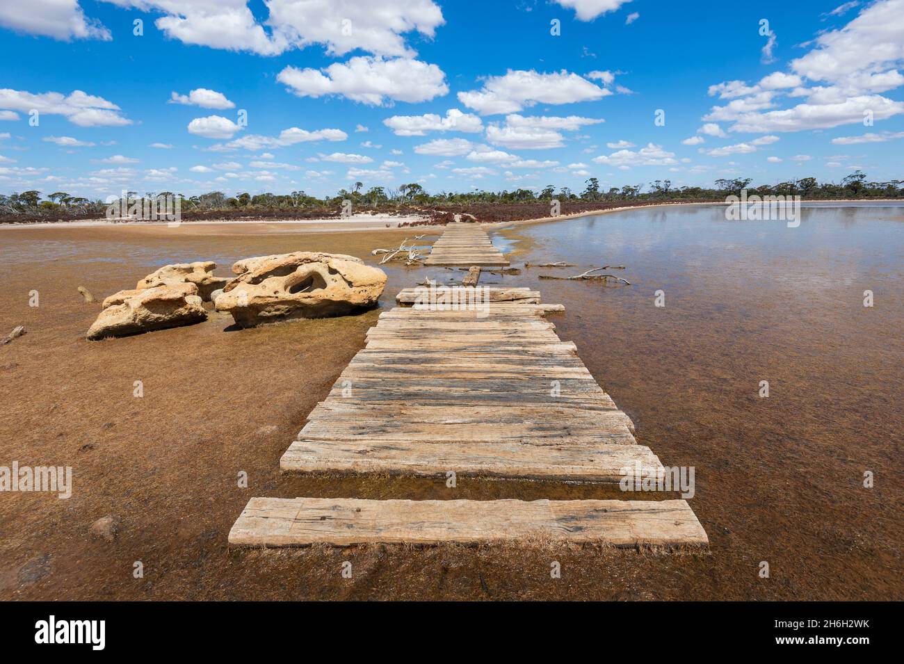 Old style Corduroy Road of wooden beams across marshes, near Lake Grace, Western Australia, WA, Australia Stock Photo