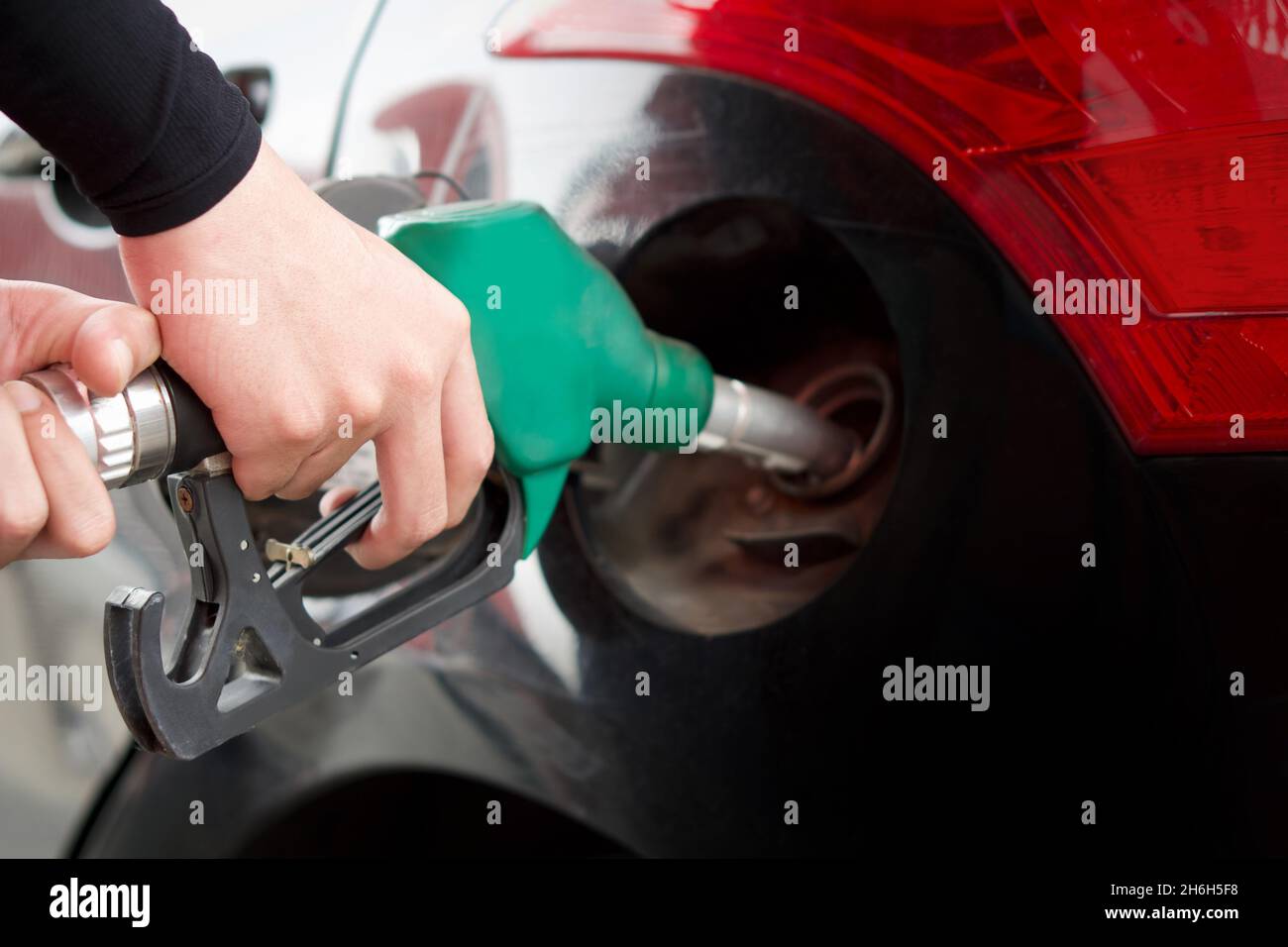 Closeup Hand Holding Green Gas Pump Nozzle Gas Station Worker Filling