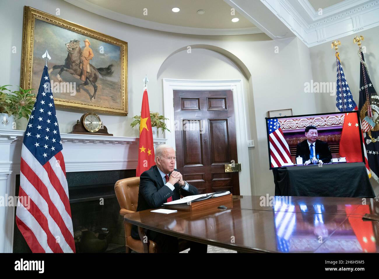 Washington, Vereinigte Staaten. 15th Nov, 2021. United States President Joe Biden listens during a virtual summit with Chinese President Xi Jinping in the Roosevelt Room of the White House in Washington DC on Monday, November 15, 2021. Credit: Sarah Silbiger/Pool via CNP/dpa/Alamy Live News Stock Photo