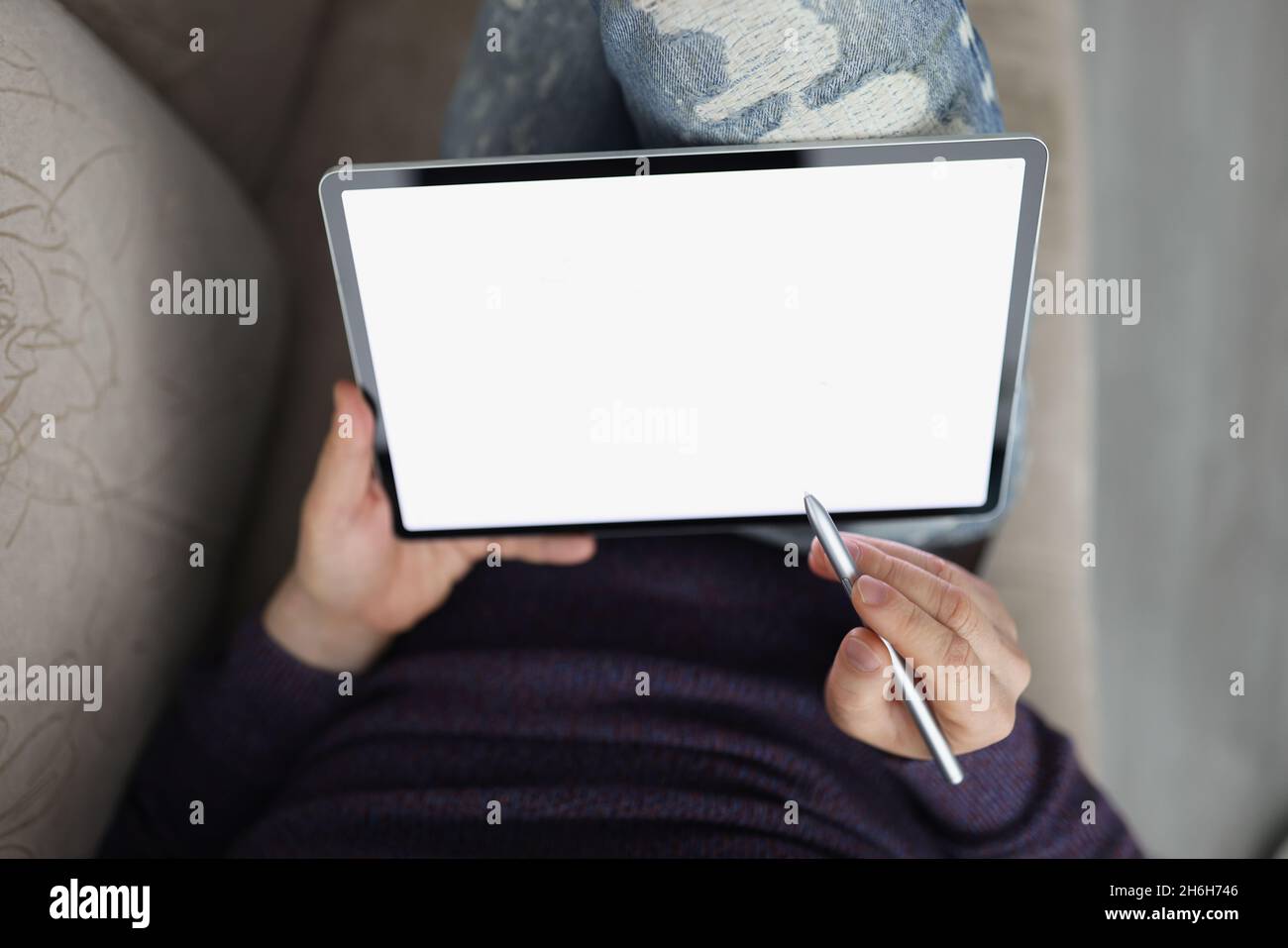Man surfing internet on modern tablet with stylus Stock Photo
