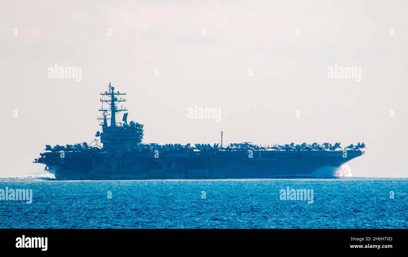 210924-N-JW440-1055 SOUTH CHINA SEA (September 24, 2021). The navy’s only forward deployed aircraft carrier USS Ronald Reagan (CVN 76) transits the South China Sea. Reagan is attached to Commander, Task Force 70/Carrier Strike Group 5 conducting underway operations in support of a free and open Indo-Pacific. (U.S. Navy Photo by Mass Communication Specialist 1st Class Rawad Madanat) Stock Photo