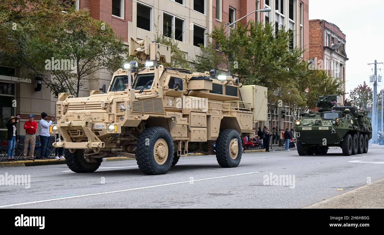 U.S. Army National Guard Soldiers with the 122nd Engineer Battalion participate in the annual Veterans Day parade Nov. 11, 2021 in Columbia, South Carolina with a Mine Resistant Ambush Protected vehicle. The South Carolina National Guard is a community-based organization and participates in community events to bring visibility to the Soldiers, Airmen, and capabilities of the organization. (U.S. Army National Guard photo by Sgt. Tim Andrews) Stock Photo