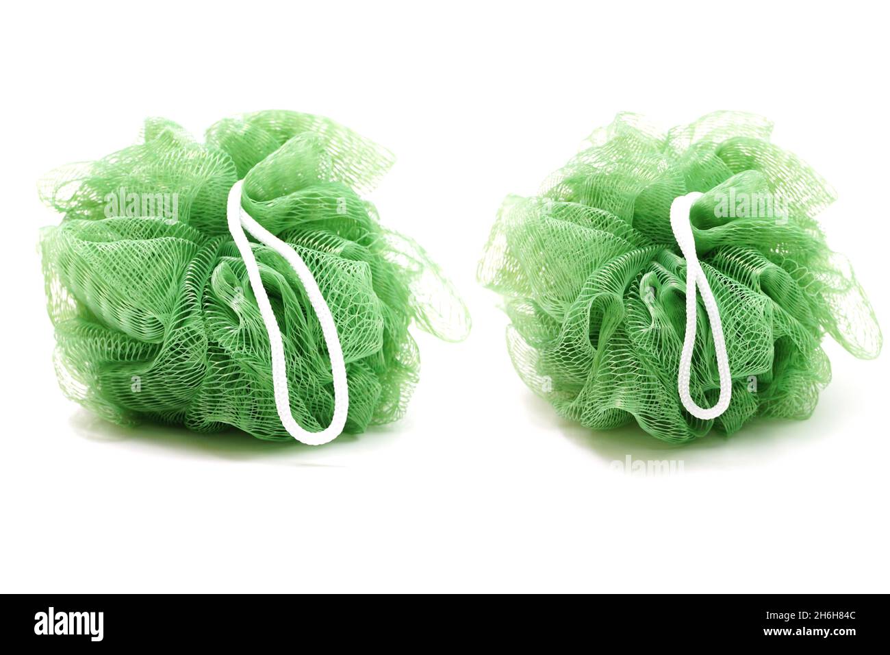Green bath soft with rope isolated on white background Stock Photo - Alamy