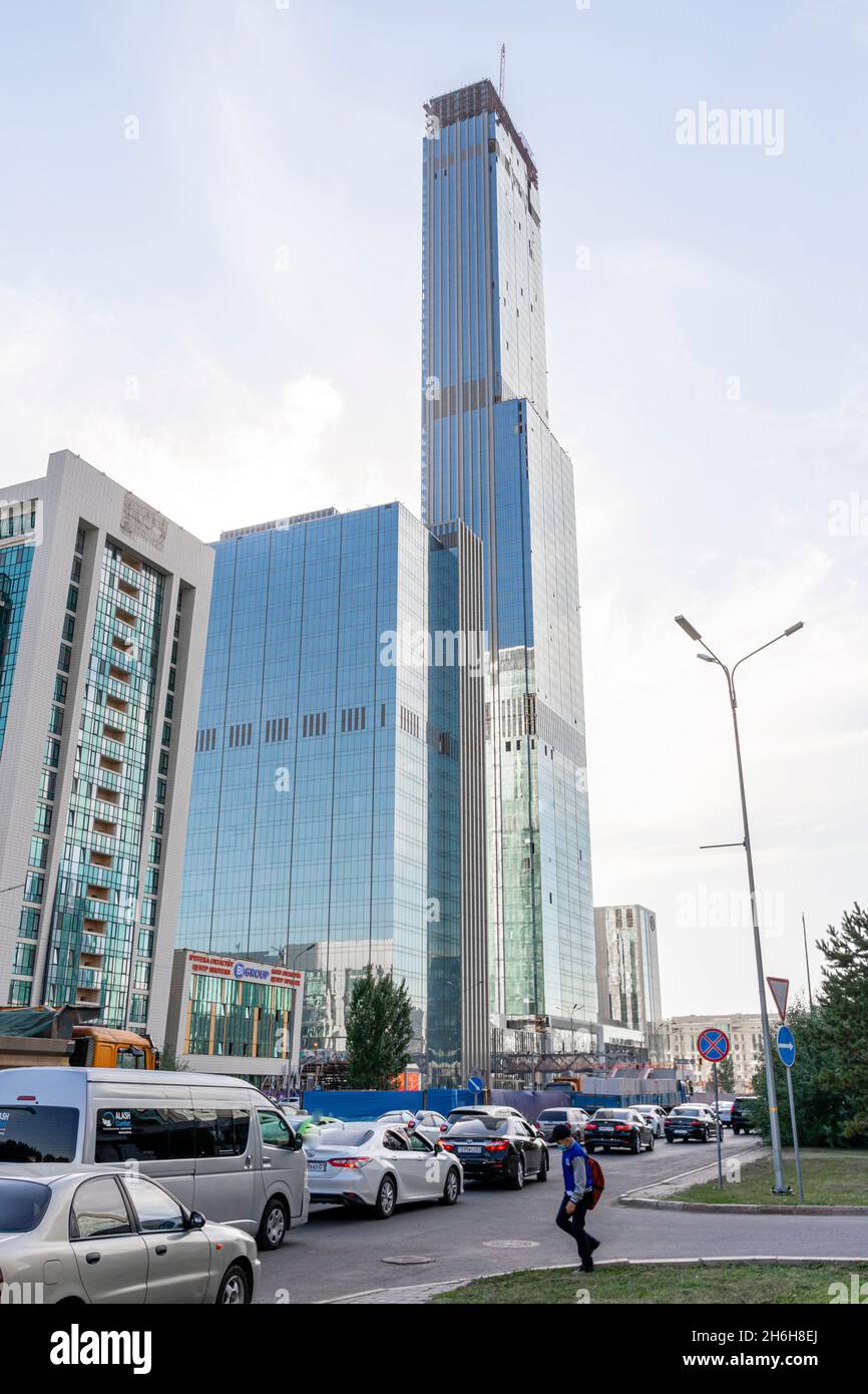 Qazaqstan, tallest building in Central Asia in a mixed-use development complex Abu-Dabi plaza in Nur-Sultan, Kazakhstan. Skyscraper under development. Stock Photo