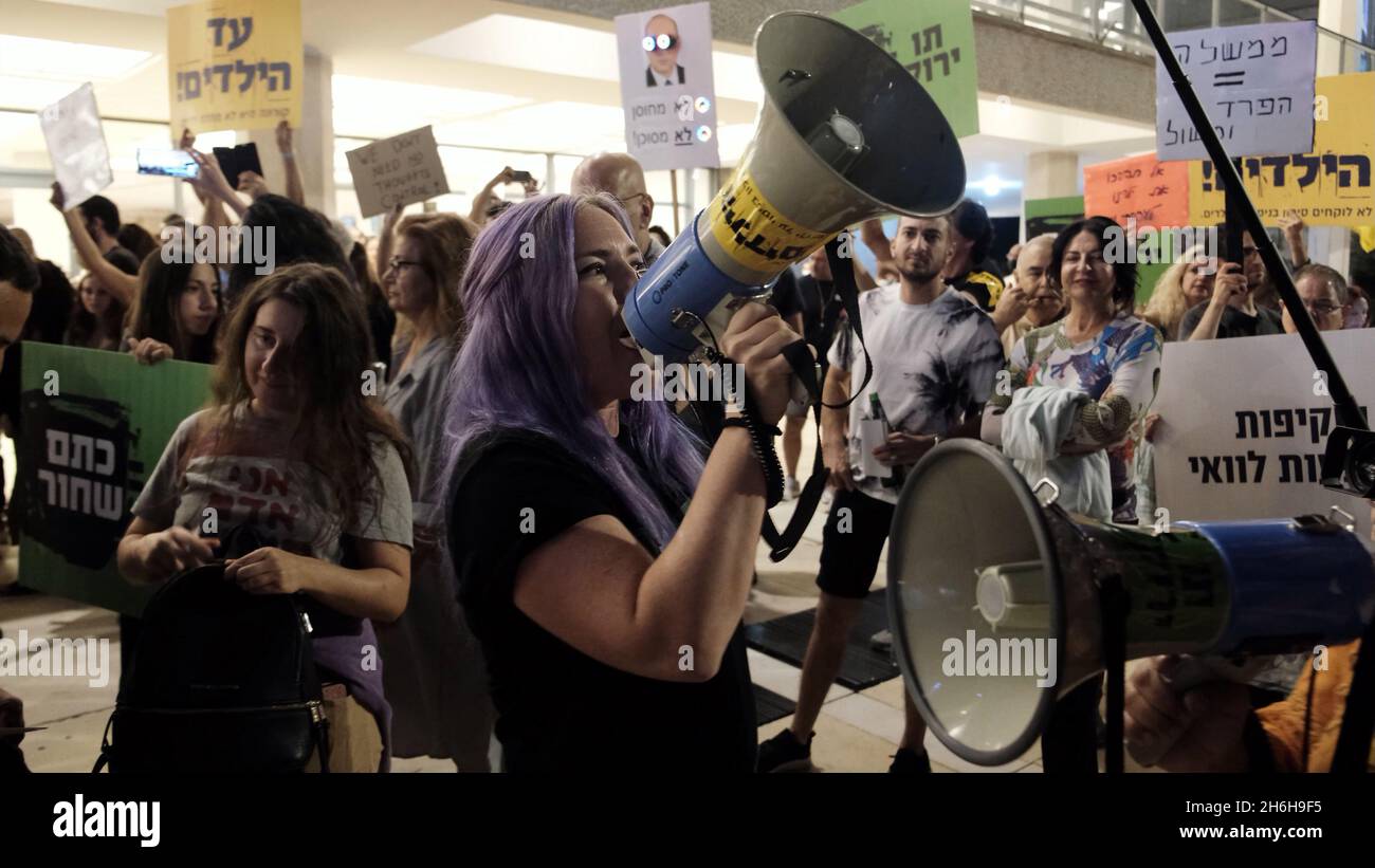 Israeli Anti-vax protesters demonstrate against forced Covid vaccination and Green Pass rules on November 13, 2021 in Tel Aviv, Israel. A panel of medical experts at Israel’s Health Ministry recently voted in favor of a COVID vaccine for kids in a secret ballot. Stock Photo
