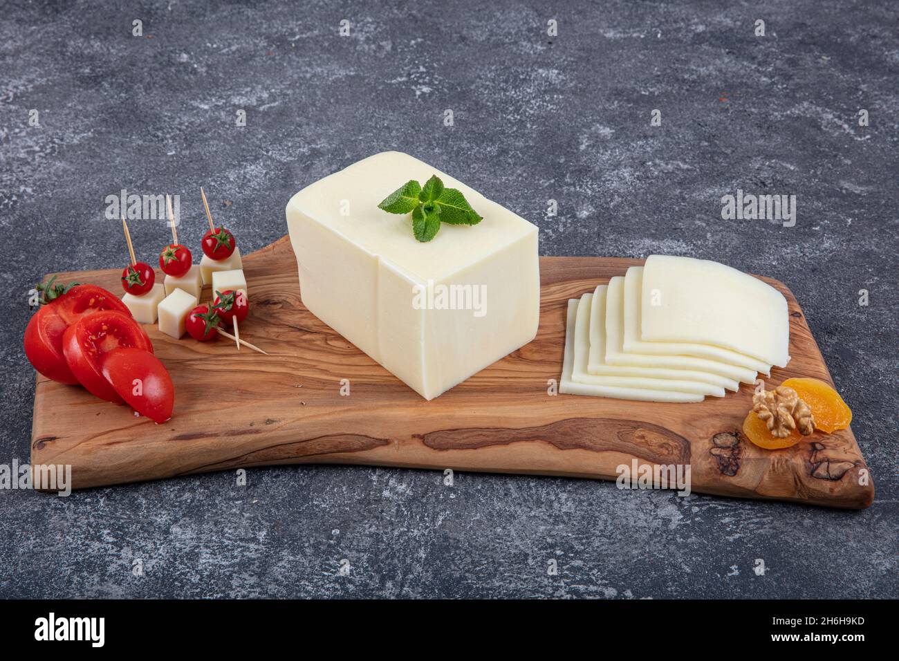 Kashar cheese or kashkaval cheese. Sliced Cheddar Cheese. gourmet cheese. local name taze kasar peyniri Stock Photo