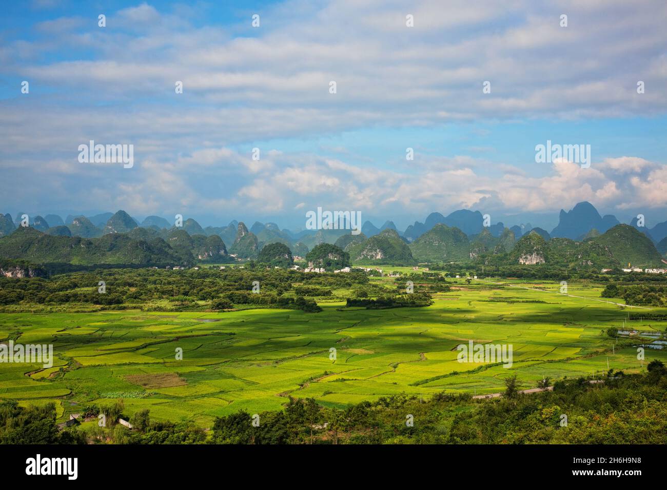 The beautiful countryside of Guilin, showing rice farms and Karst mountains.  Guangxi Zhuang Autonomous Region, China Stock Photo