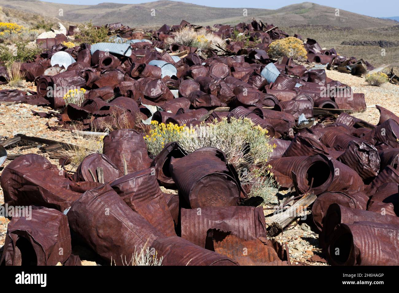 A garbage dump of rusted cans in Bodie State Park, California Stock Photo
