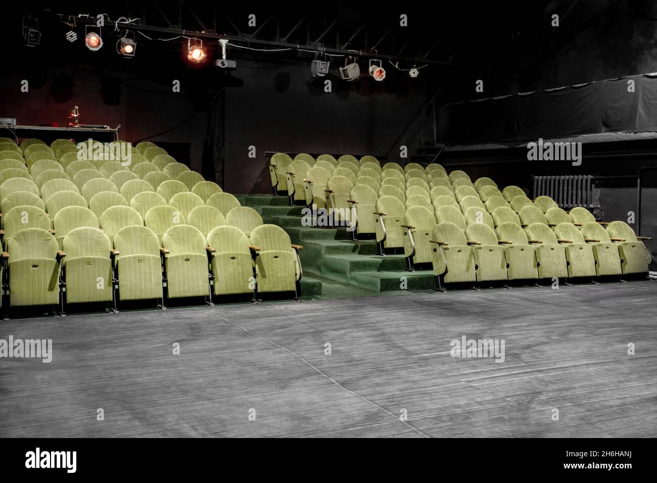 Image of a small auditorium with green armchairs Stock Photo