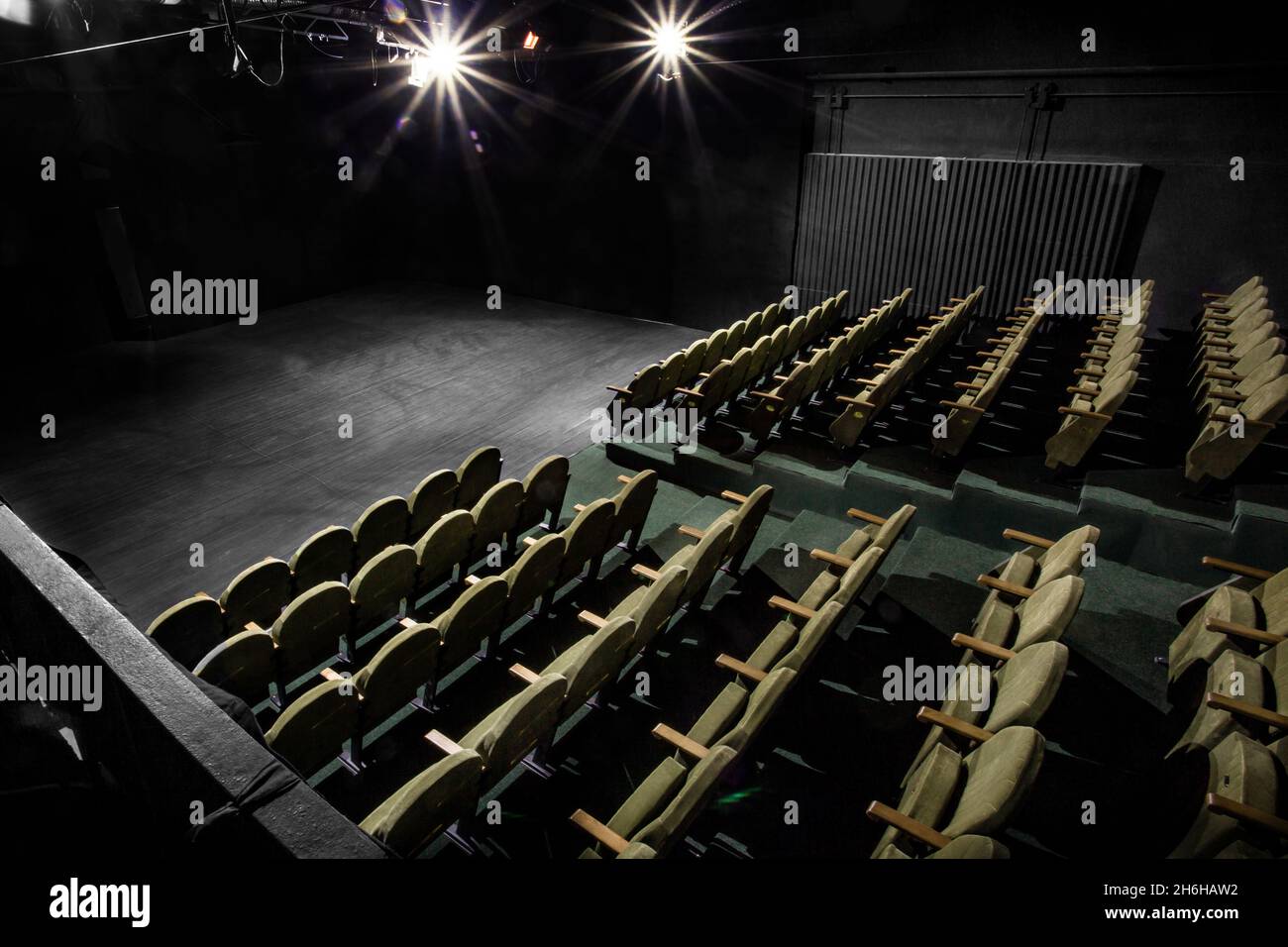 Image of a small auditorium with green armchairs Stock Photo