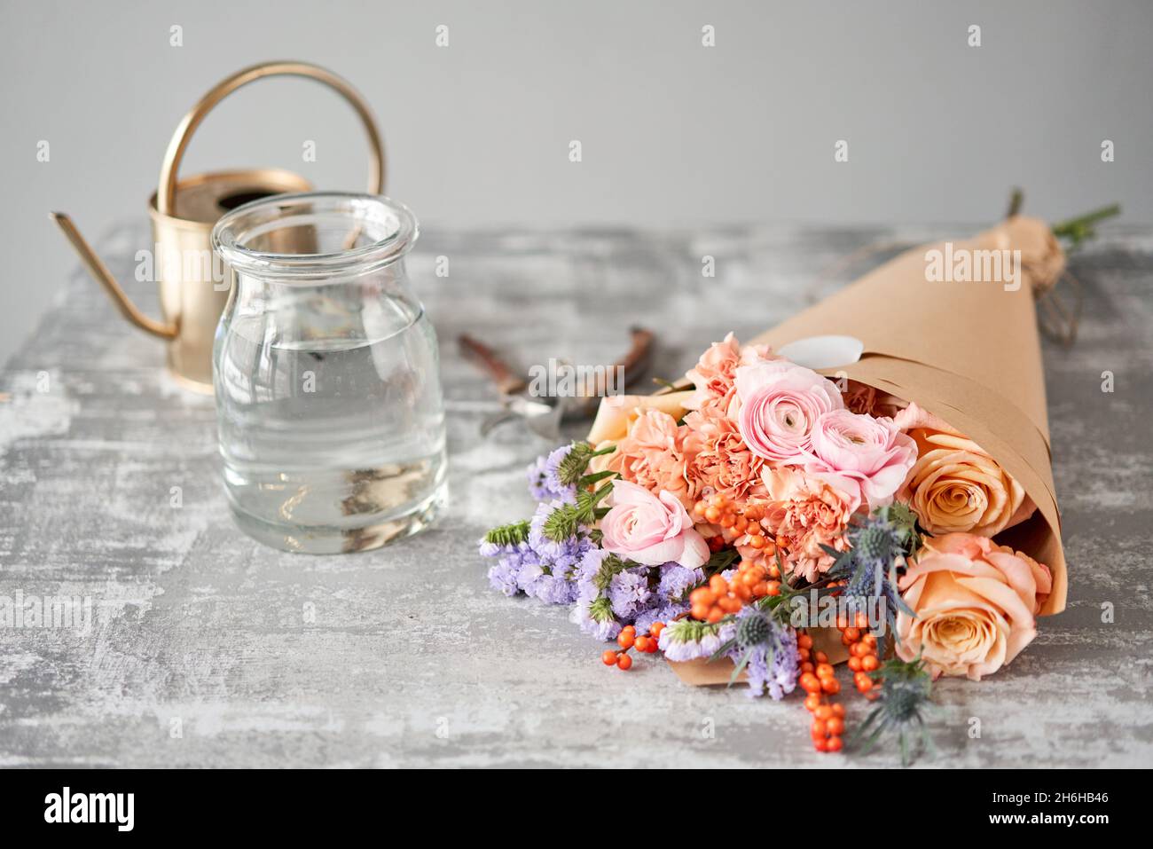 Step by step installation of flowers in a vase. Flowers bunch, set for home. Fresh cut flowers for decoration home. European floral shop. Delivery fre Stock Photo