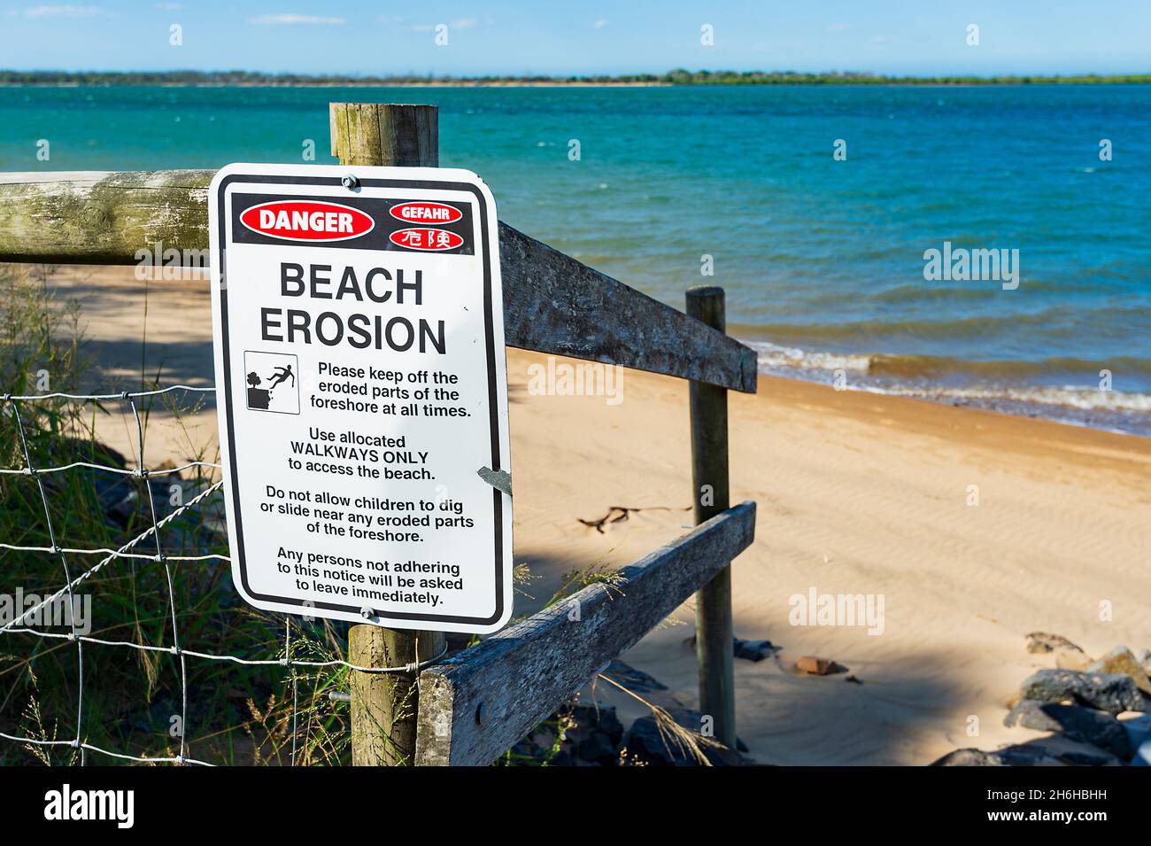 Sign warning of beach erosion at Miara, Queensland, QLD, Australia Stock Photo