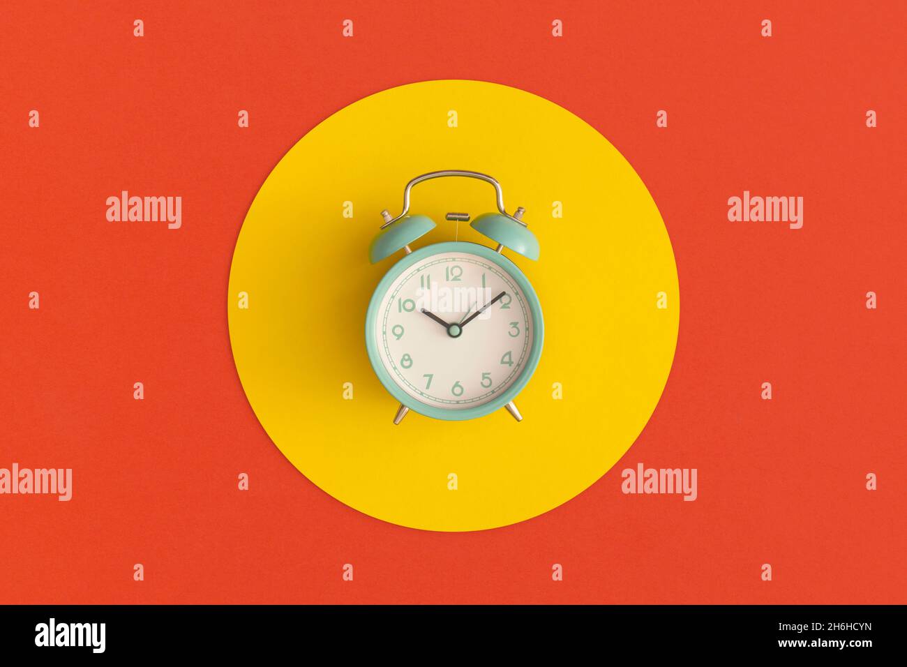 Blue alarm clock on color background. Top view with copy space. Flat ...