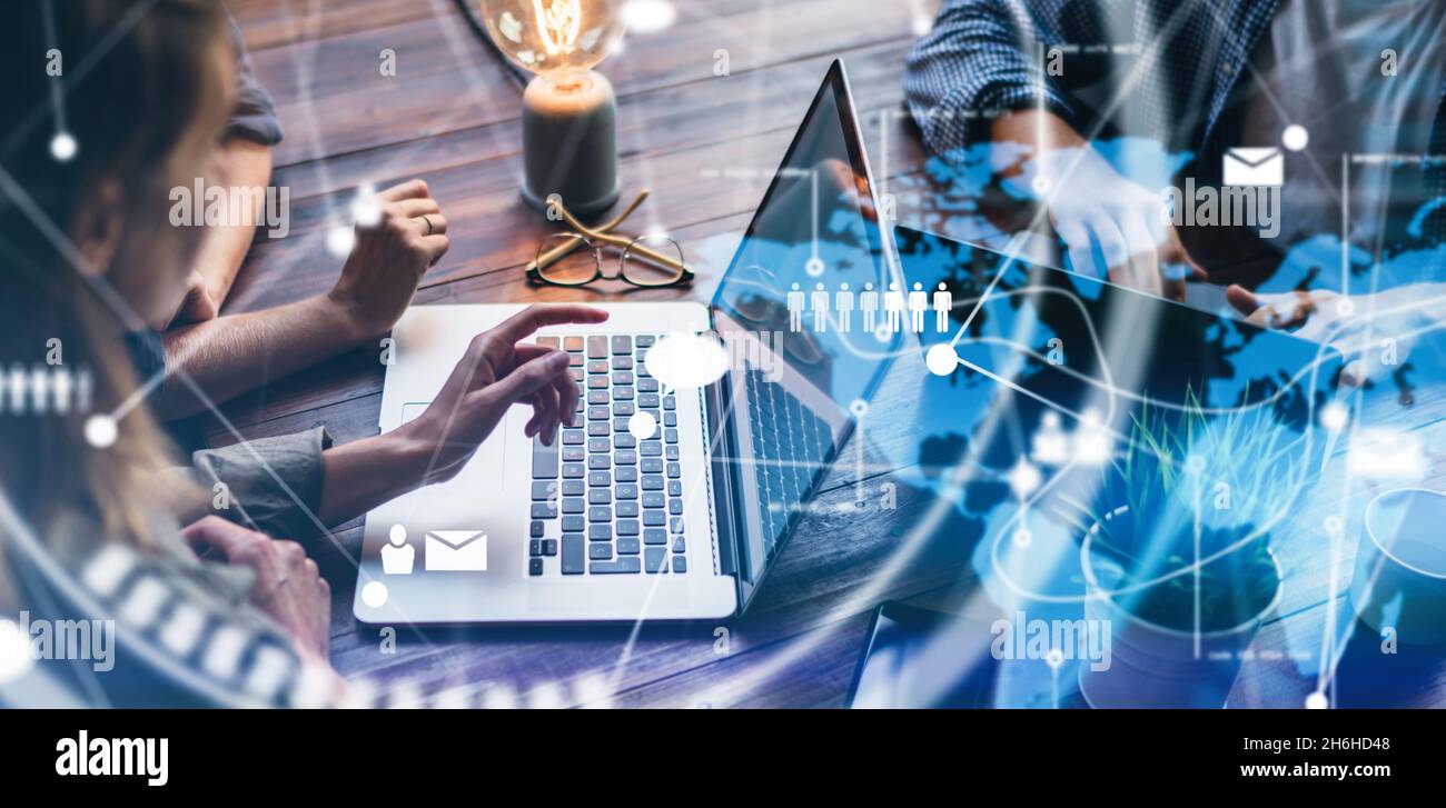 Close-up photo of female hands with laptop. Young woman working remotely at home. Concept of networking or remote work. Global business network. Onlin Stock Photo