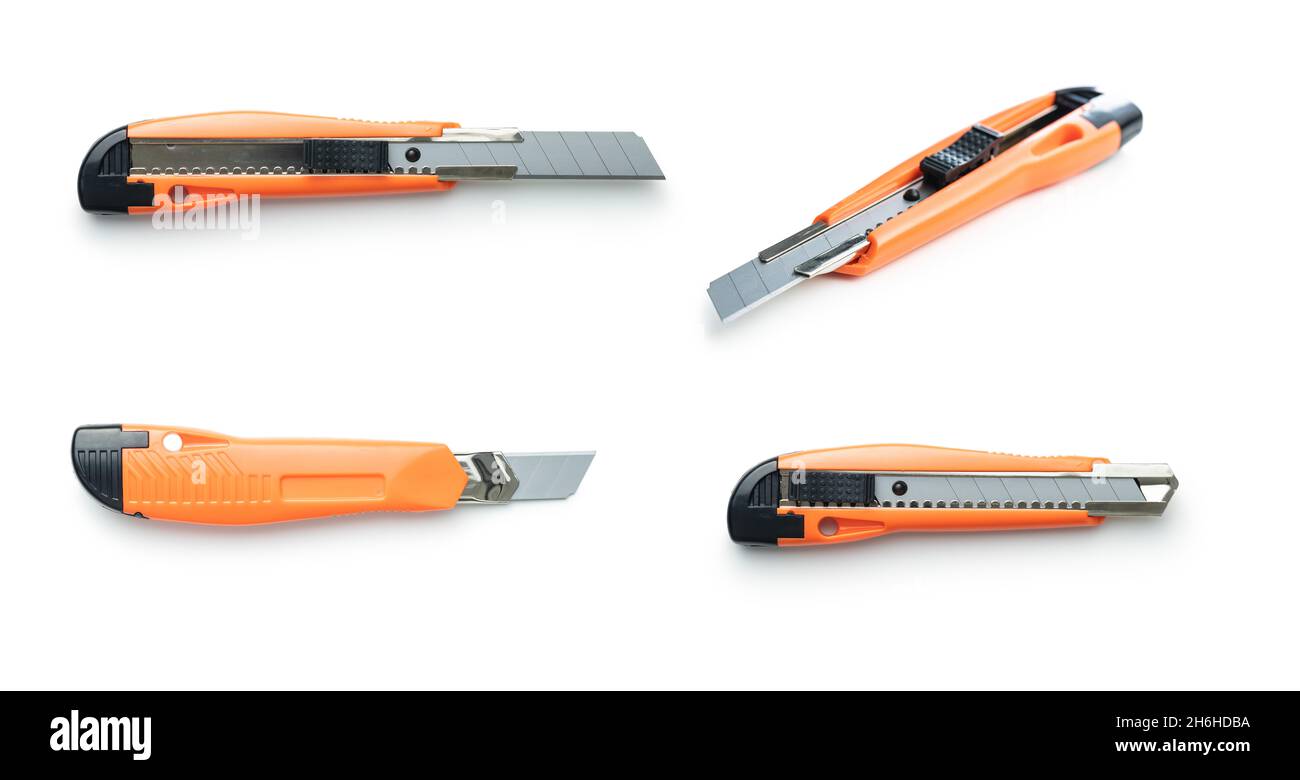 Plastic orange utility knife isolated on white background. Stock Photo