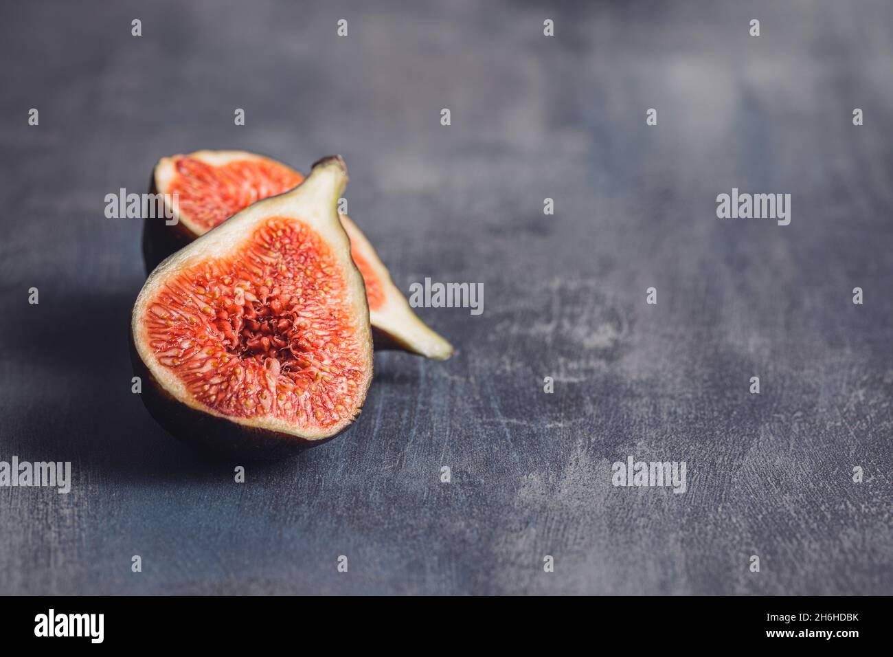 Fresh ripe figs on kitchen table. Stock Photo