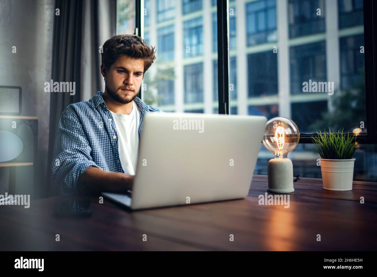 Professional journalist typing article on hi-res stock photography and ...