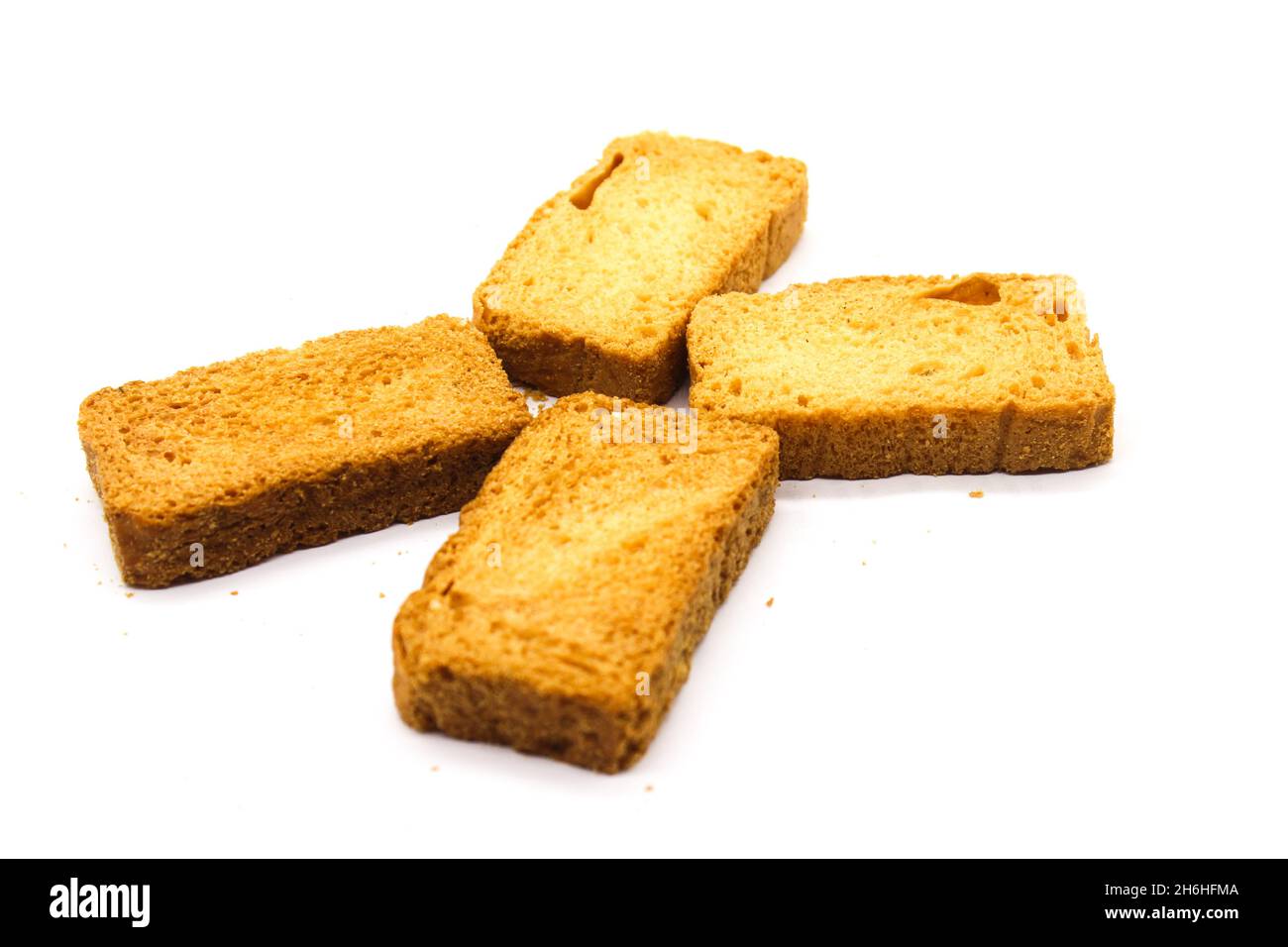 Crispy rusk on white background with selective focus Stock Photo - Alamy