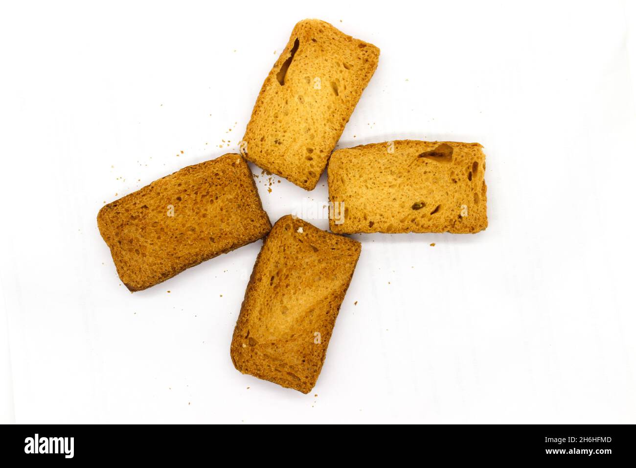 Crispy rusk on white background with selective focus Stock Photo - Alamy