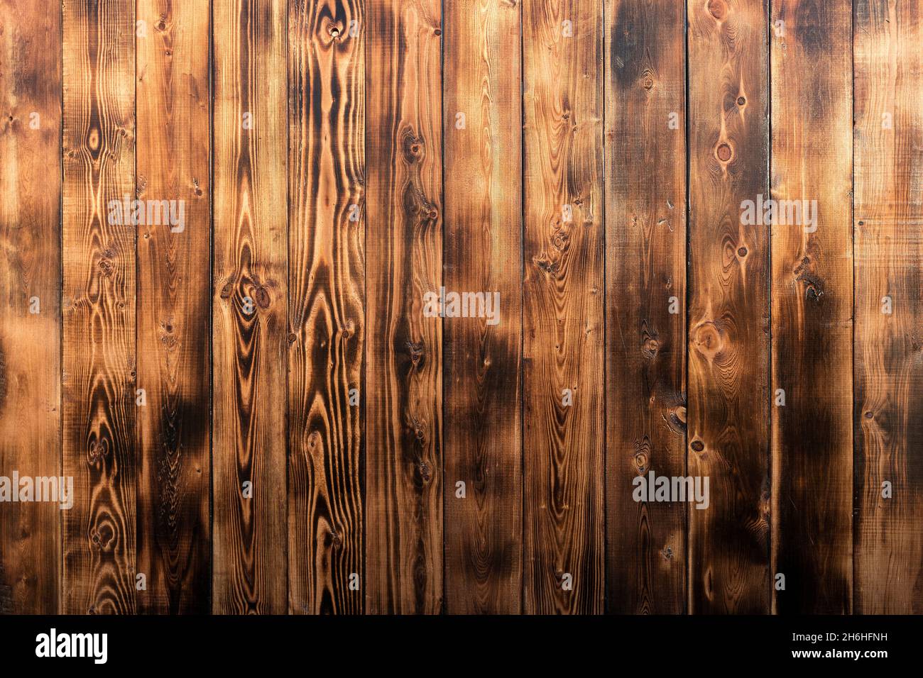 Wooden rustic background. Wooden surface with old burnt texture. Dark
