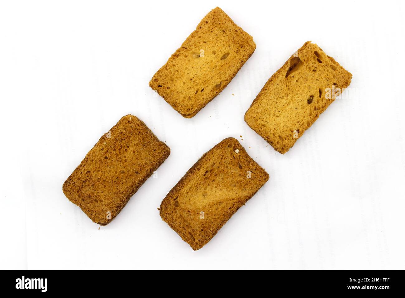 Crispy rusk on white background with selective focus Stock Photo - Alamy