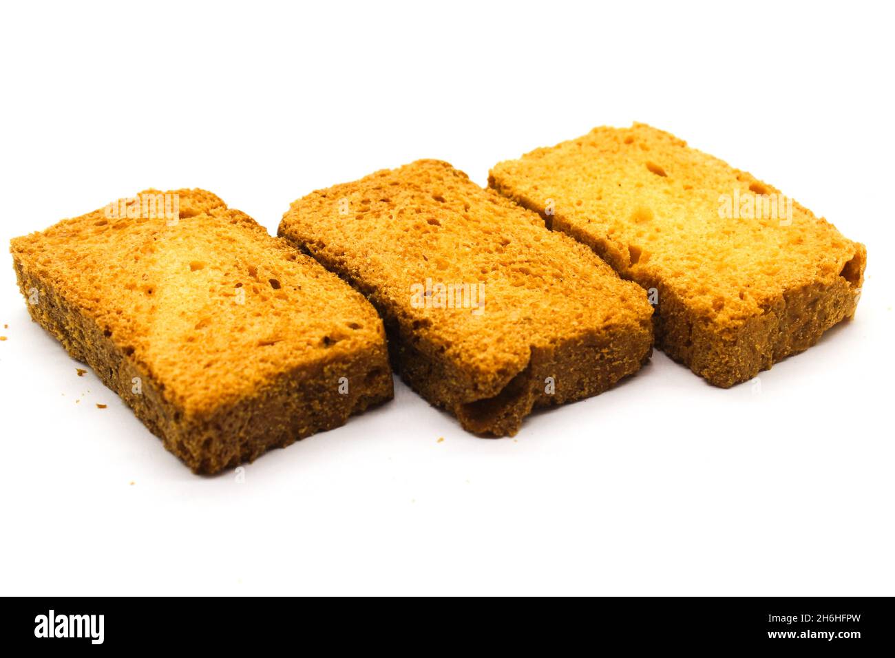 Crispy rusk on white background with selective focus Stock Photo - Alamy