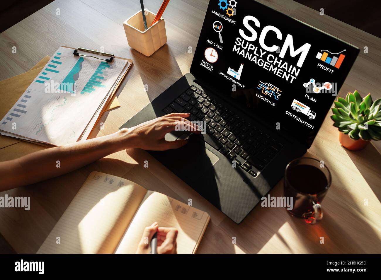 SCM - Supply Chain Management and business strategy concept on the screen. Stock Photo