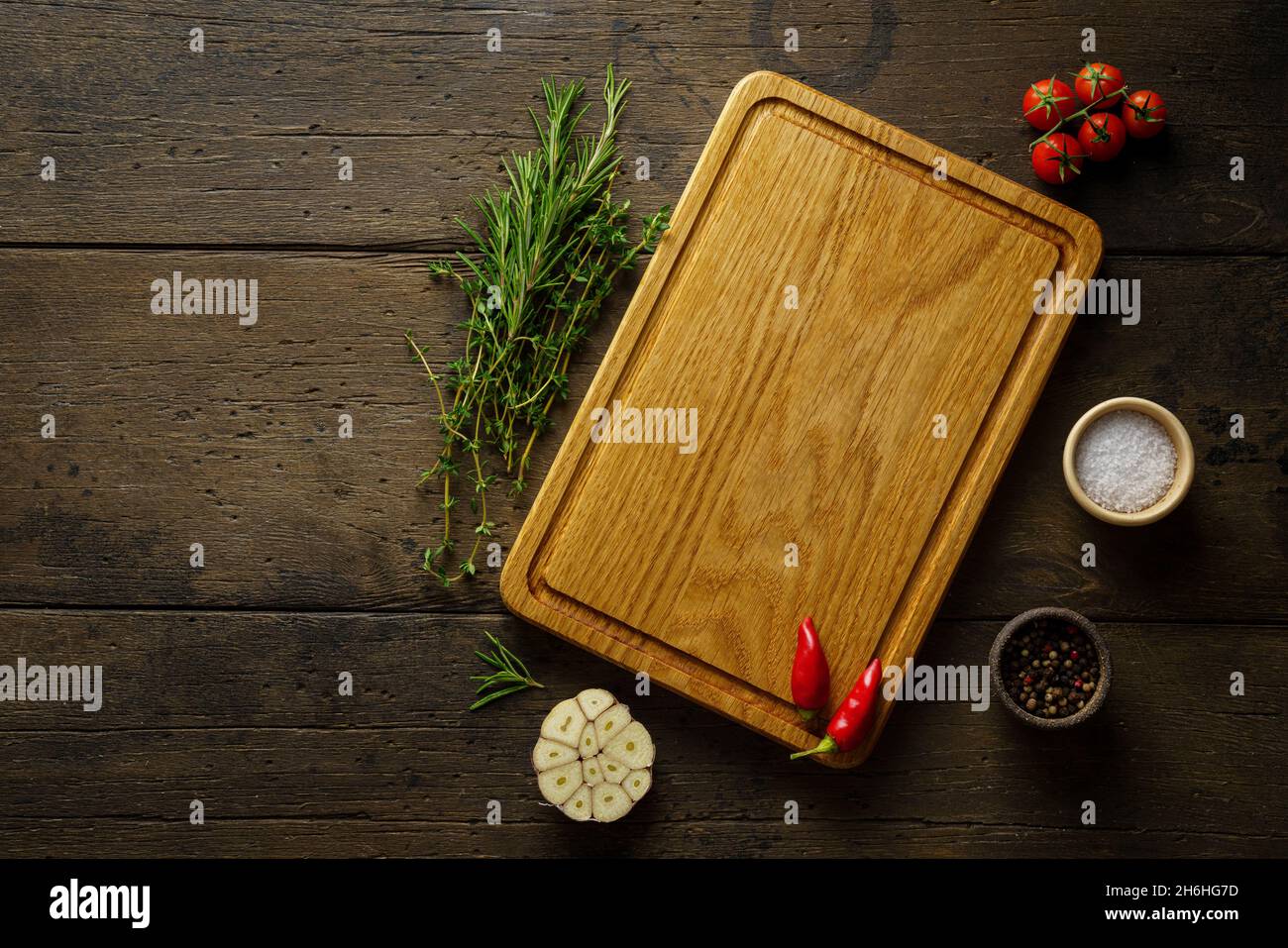 Wooden cutting board. Food seasoning background, Spices, herbs. Recipe