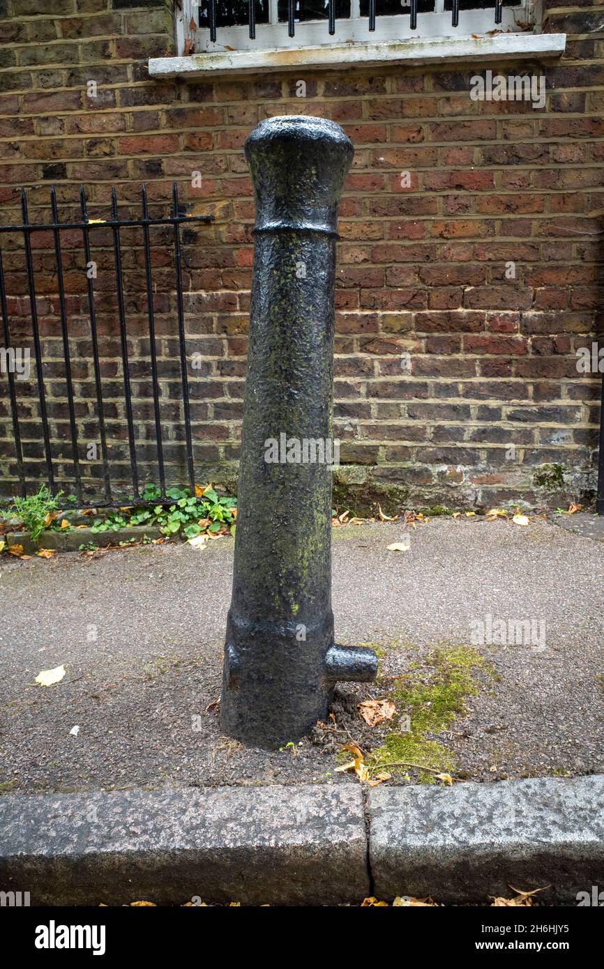 Authentic British naval cannon, 18C/19C, used as a bollard on Cannon Lane in Hampstead, London, England Stock Photo
