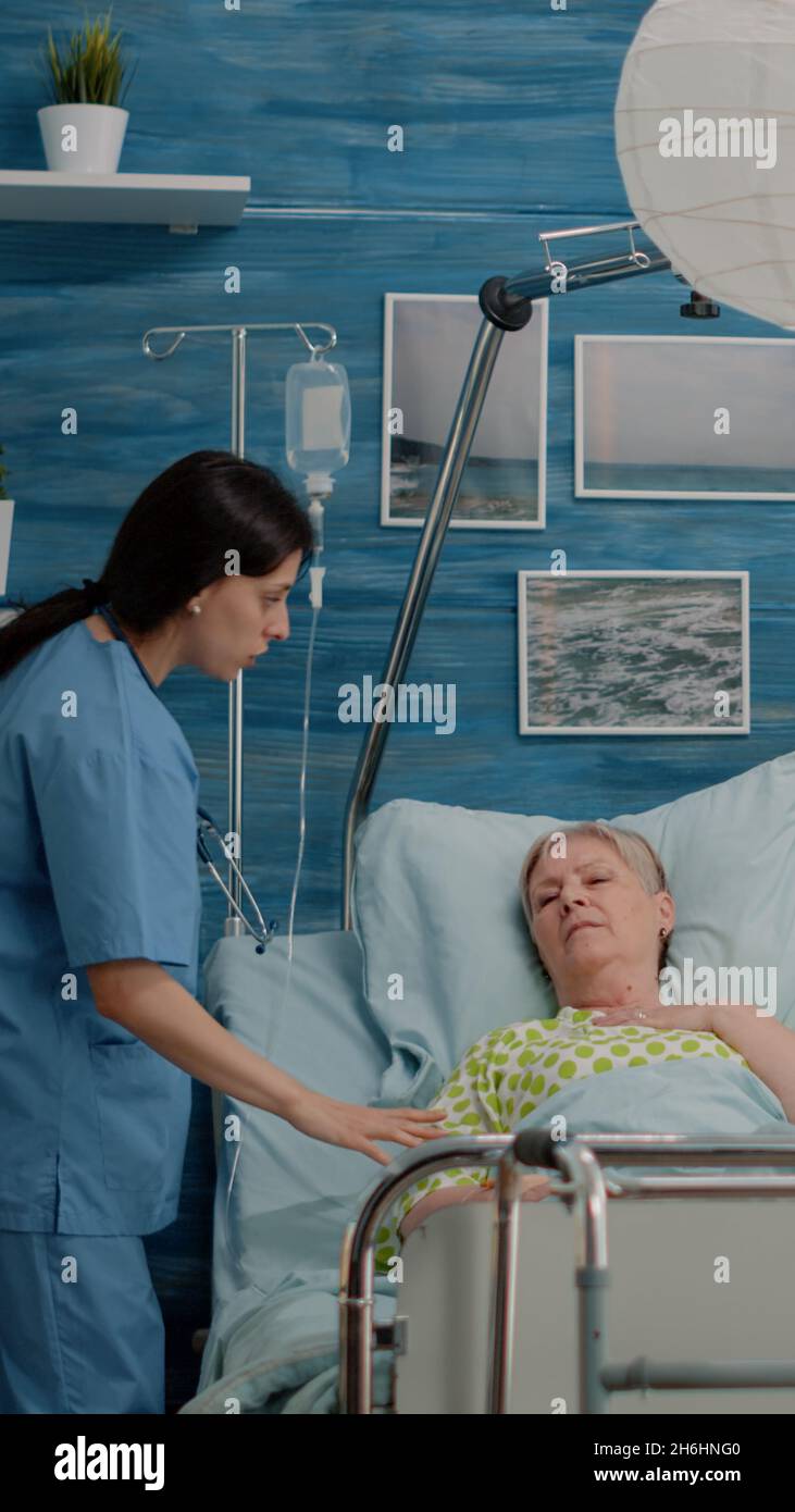 Worried man calling for medical assistance while woman breathing heavy