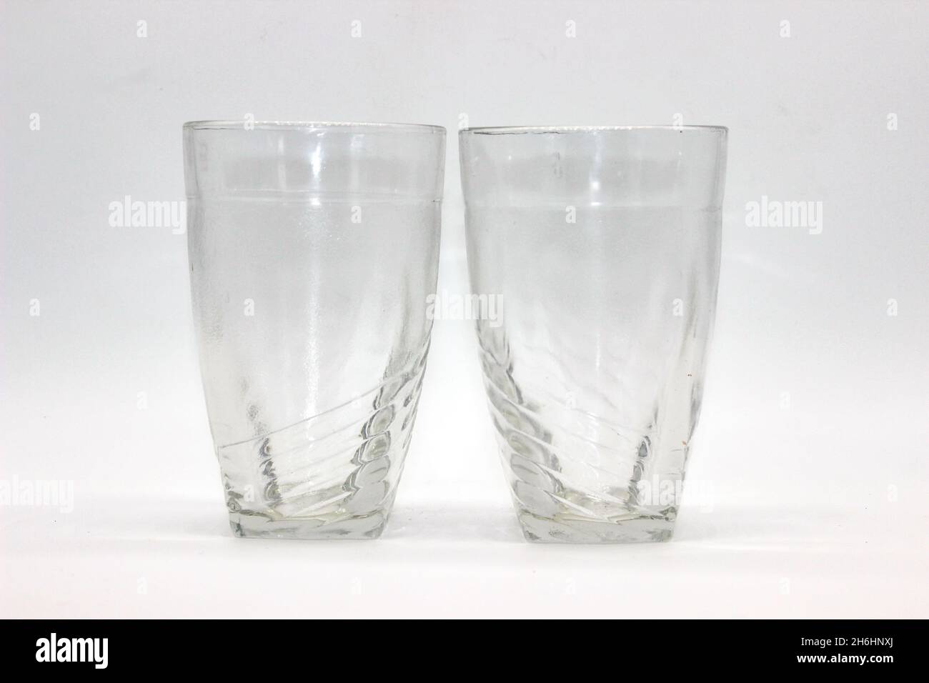 https://c8.alamy.com/comp/2H6HNXJ/glass-tumblers-isolated-on-white-background-with-selective-focus-2H6HNXJ.jpg