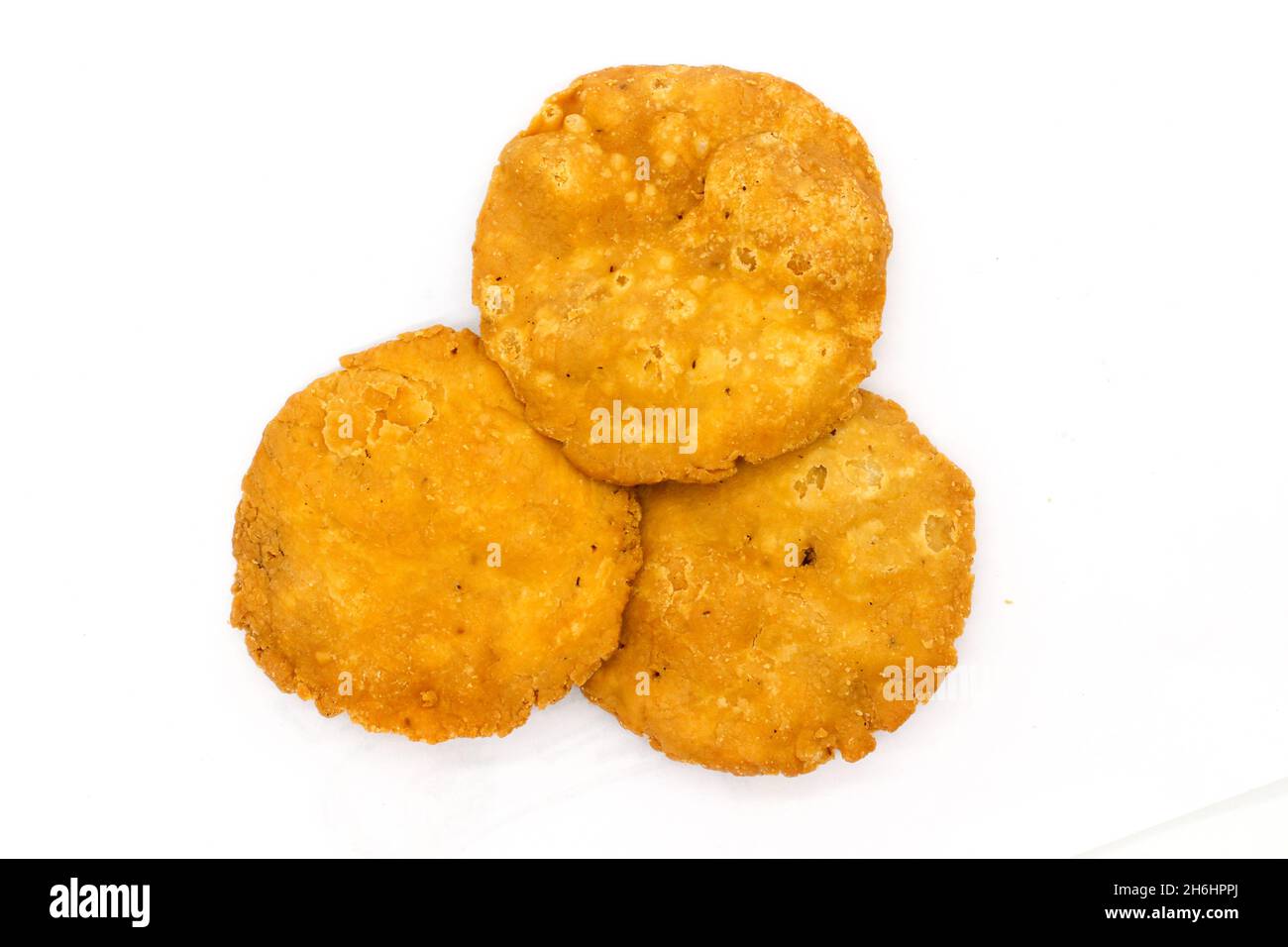 Salty Mathi Crispy and salty mathri on white background with selective focus Stock ...